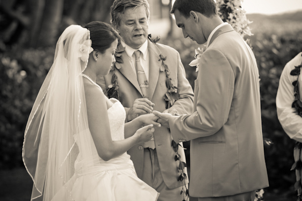 beautiful sepia tone ceremony photo - bride and groom ring exchange - real wedding photo by John and Joseph Photography
